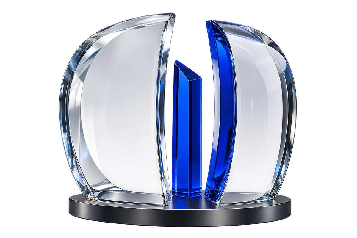 Curved optical-glass panels surrounding a cobalt-blue prism on a graphite base.