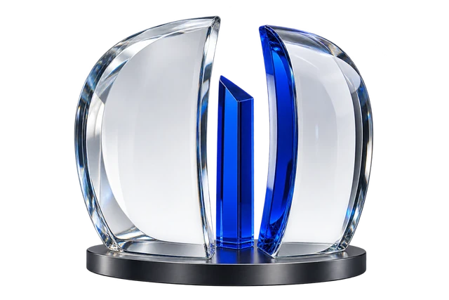 Curved optical-glass panels surrounding a cobalt-blue prism on a graphite base.